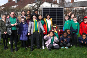 Children with photovoltaic solar panels at St Patrick's School, Cardiff.